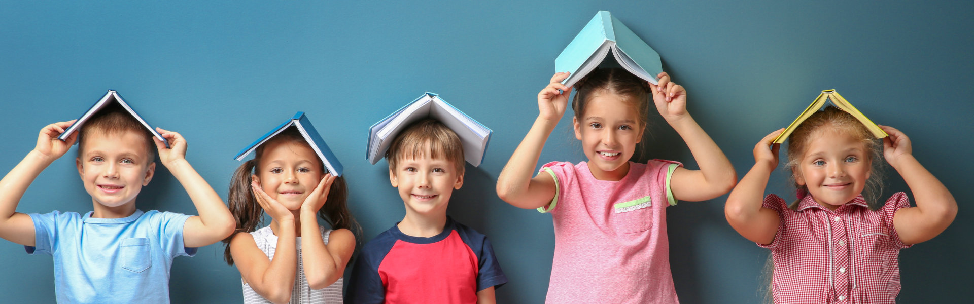 kids holding a book